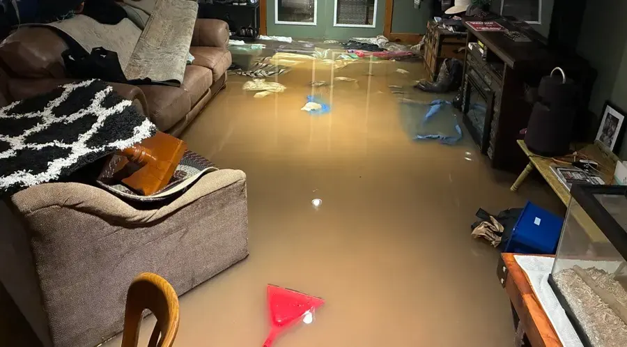 Floodwater standing in a living room after a heavy storm